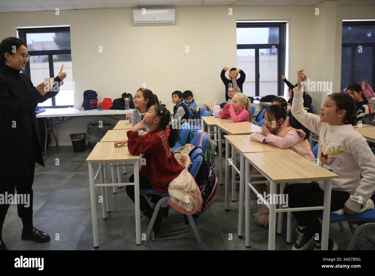 (250303) -- LUQA, March 3, 2025 (Xinhua) -- Students attend the Chinese
