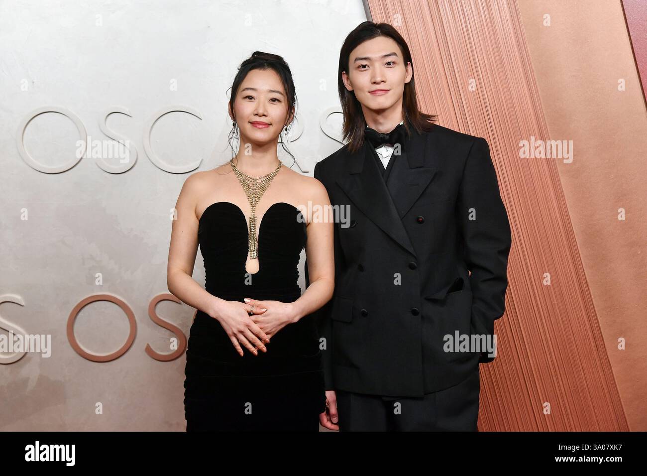 Gia Kim, left, and Sang Heon Lee arrive at the Oscars on Sunday, March ...