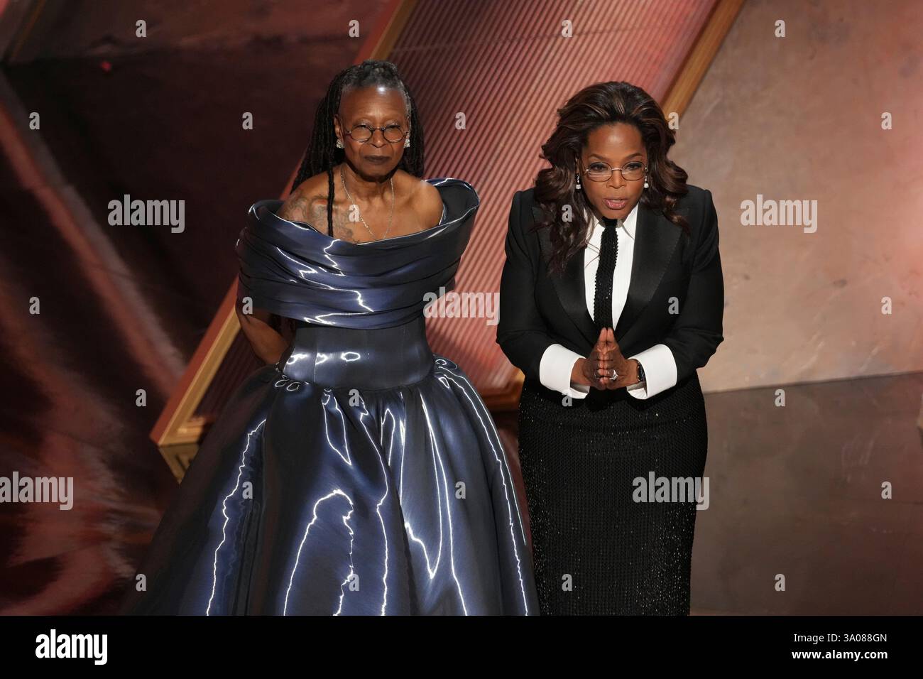Whoopi Goldberg, left, and Oprah pay tribute to Quincy Jones during the