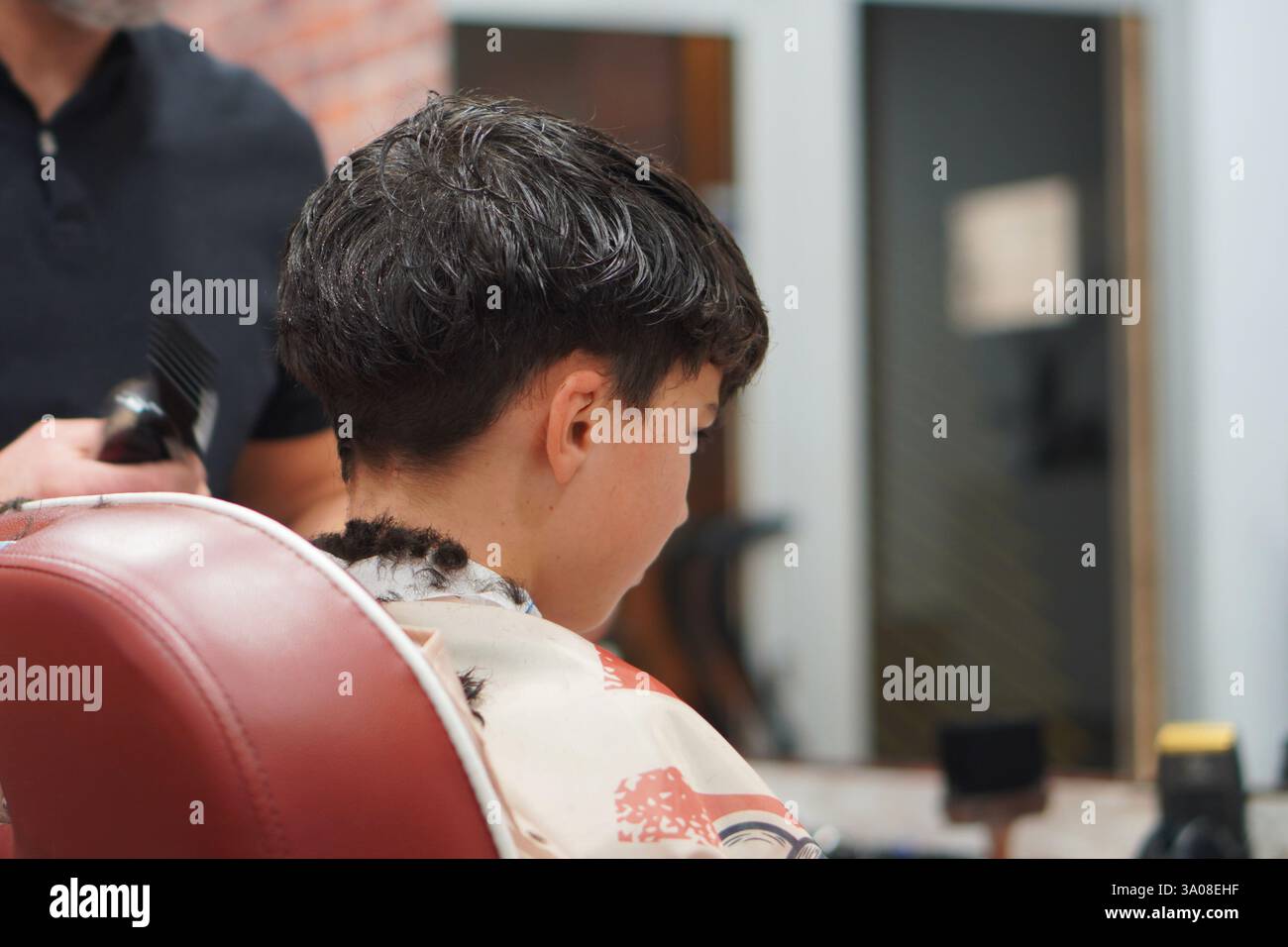 preteen boy in a getting a haircut Stock Photo Alamy