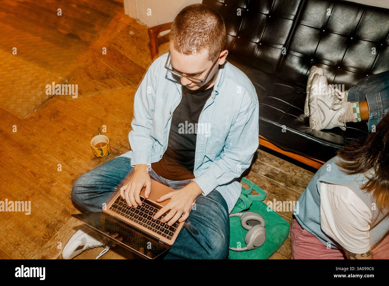 High angle view of male computer programmer working on laptop Stock Photo