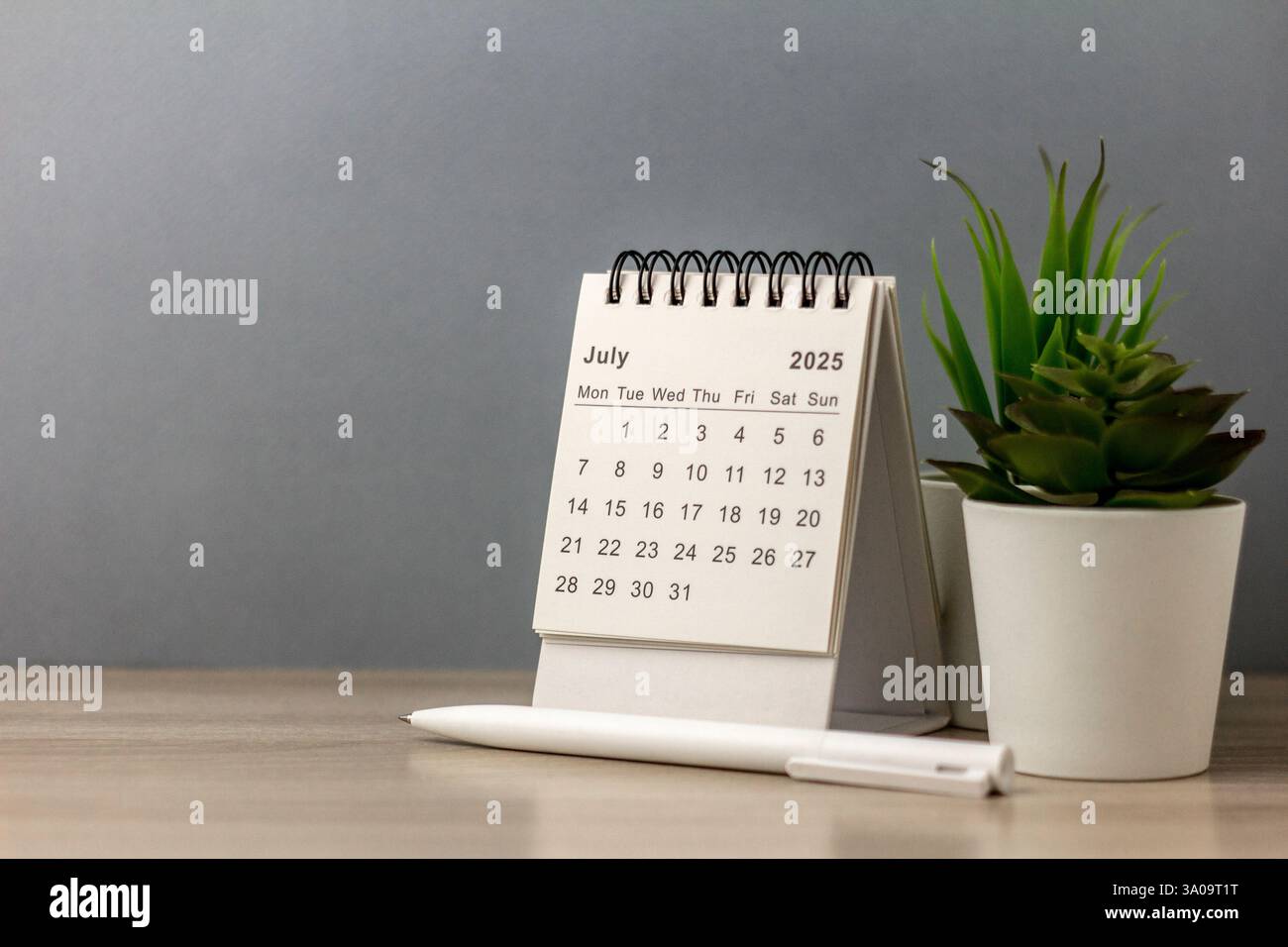 Hello July. July 2025 Planning Calendar on your desk Stock Photo - Alamy