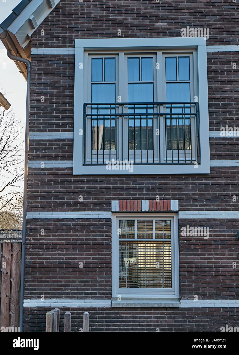 Modern Dutch architecture with a French balcony ans white-framed ...