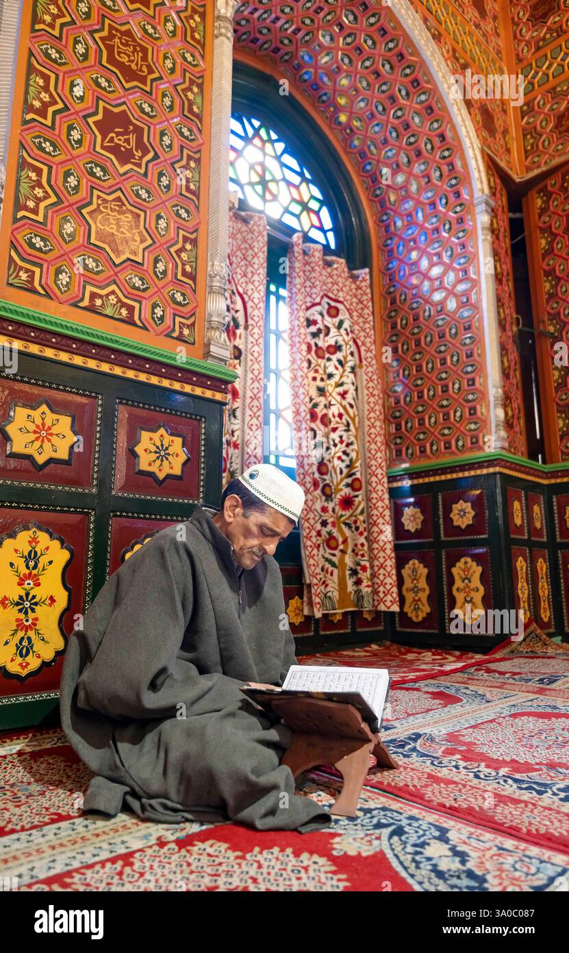 Srinagar, India. 03rd Mar, 2025. A Kashmiri Muslim man recites from the ...