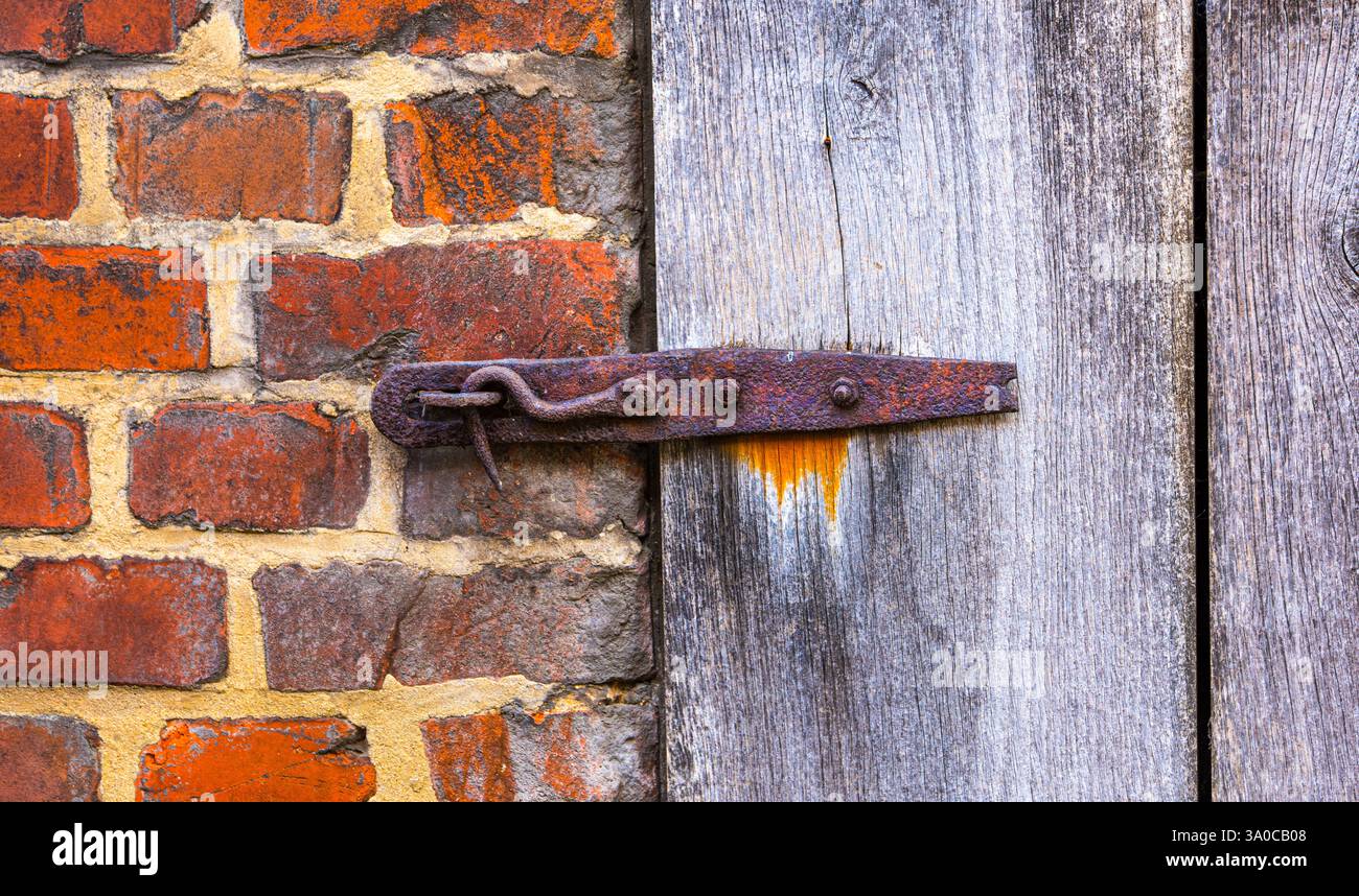 Rusted barn door lock Stock Photo