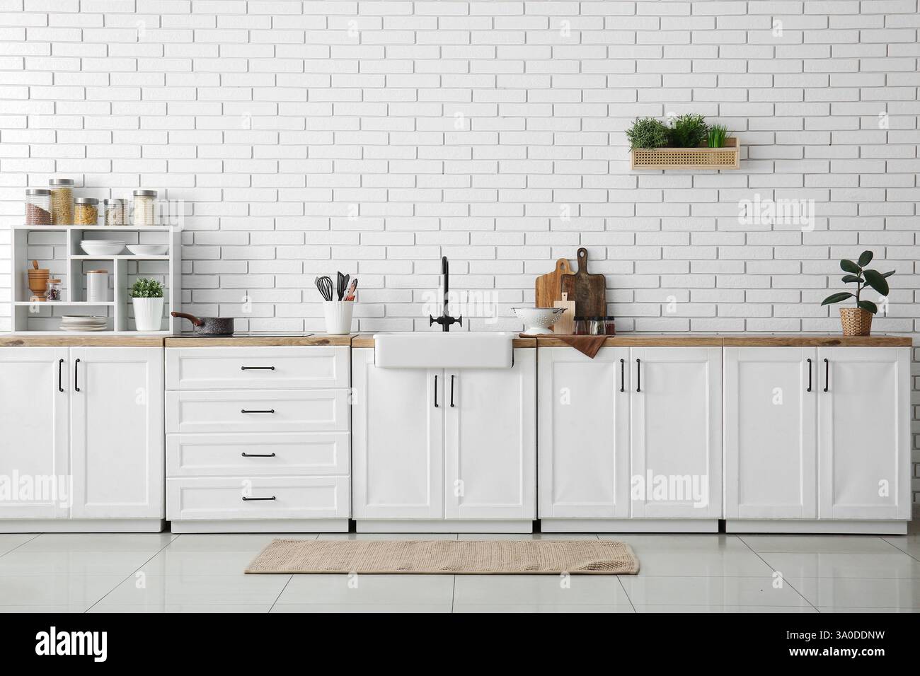Interior of kitchen with white counters, sink and utensils Stock Photo ...