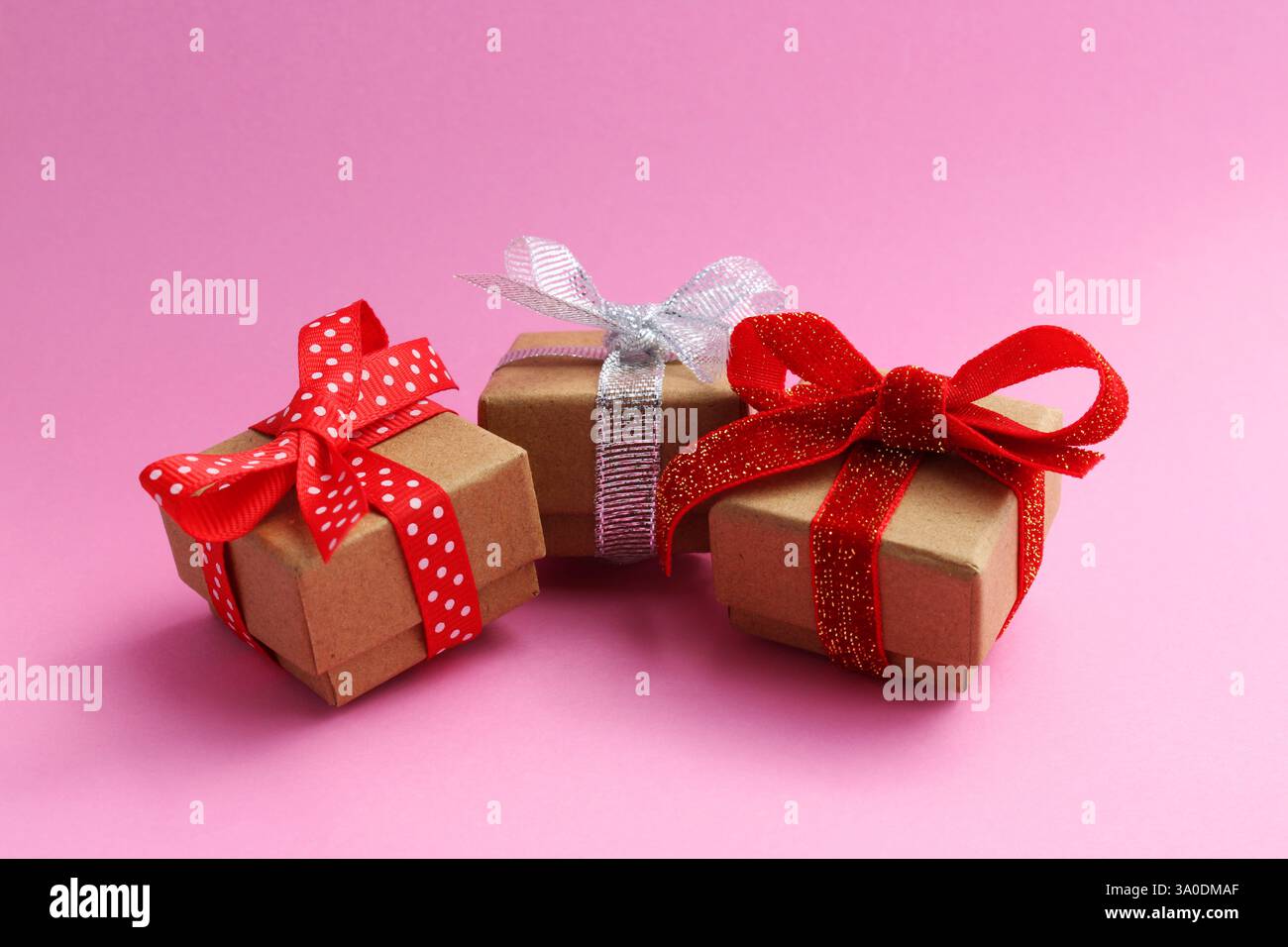 Three gift boxes with different bows Stock Photo