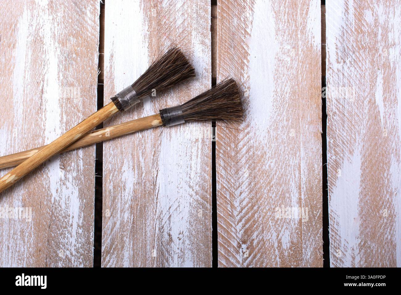 Paint brushes on technique ebru art on wooden background Stock Photo ...