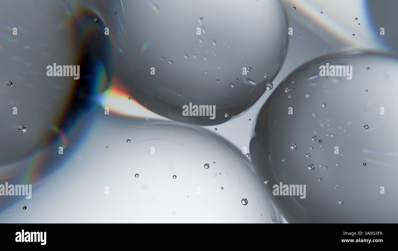 Bubbles of various sizes float in a clear liquid, illuminated by light that creates colorful reflections and refractions, showcasing an abstract and i Stock Photo