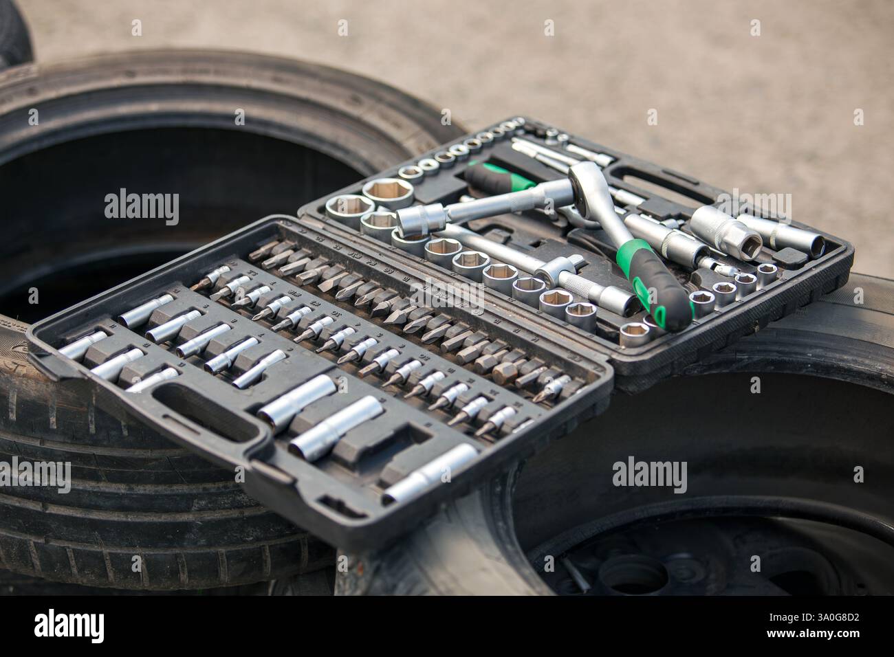 Set of tools on the car wheel. Close-up shot Stock Photo - Alamy
