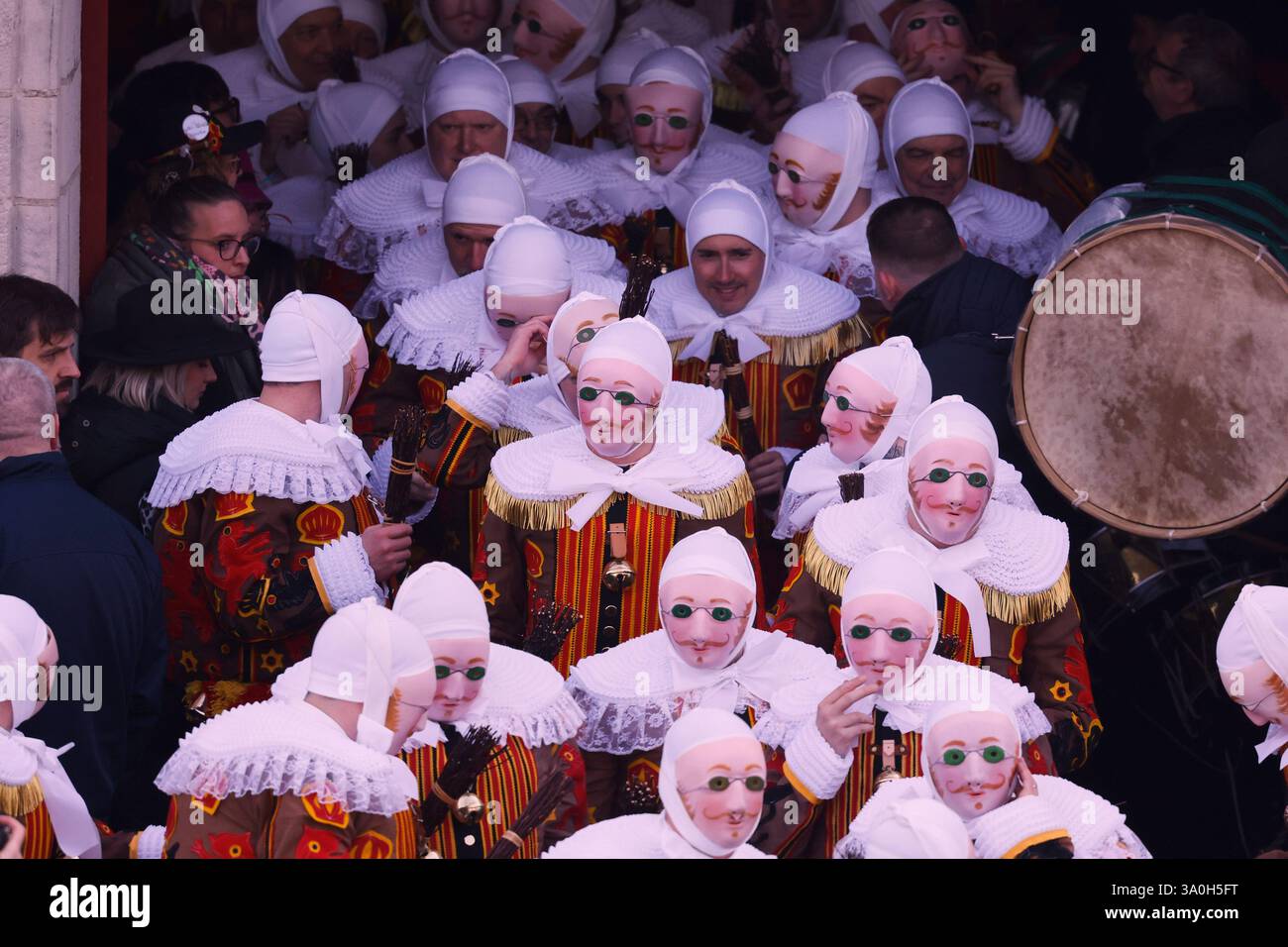 The Gilles of Binche wear their traditional wax masks as they exit the ...