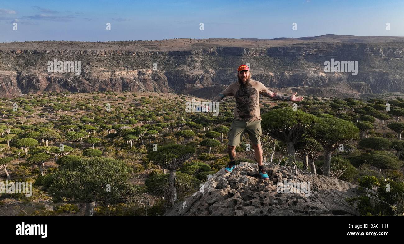 Outside Rocy A tourist stands on a rocky outcrop in Socotra, marveling at the ...