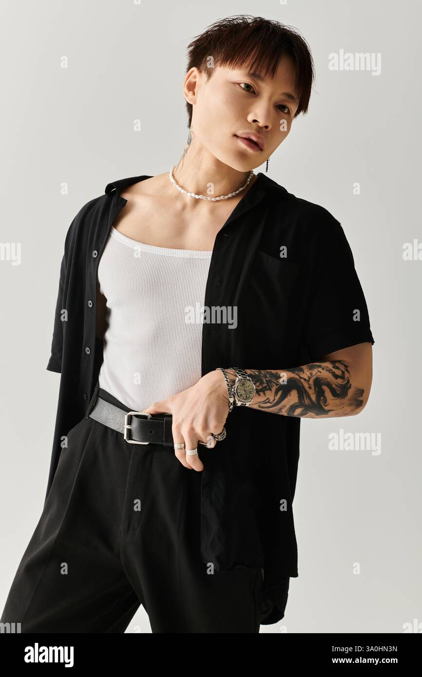 Fashion forward young man poses confidently in sleek attire with ...