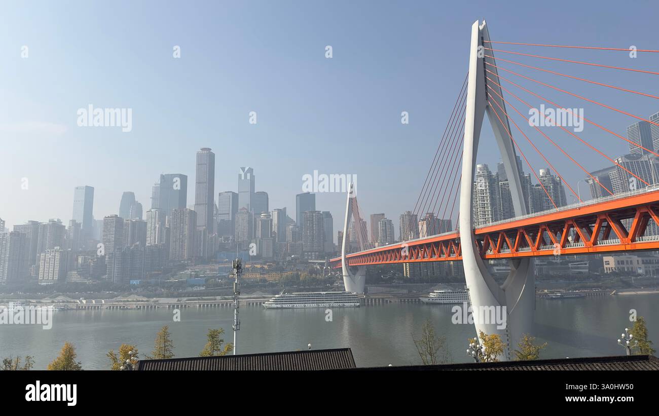 Chongqing, China - Dec 7. 2023: Dongshuimen bridge across the Yangtze river in Chongqing. - Smartphone Captured Stock Image