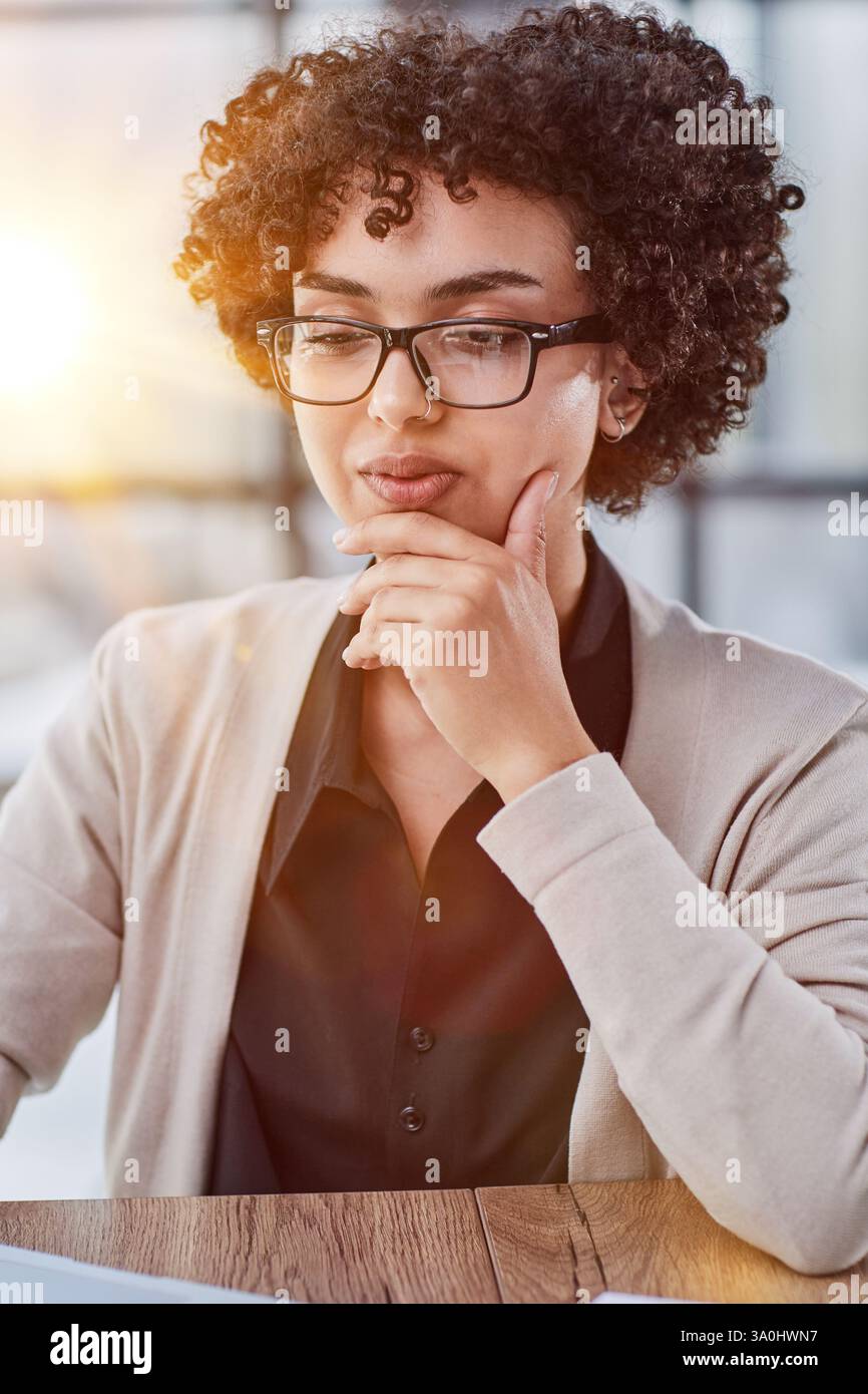 Young mixed race businesswoman smiling to camera Stock Photo