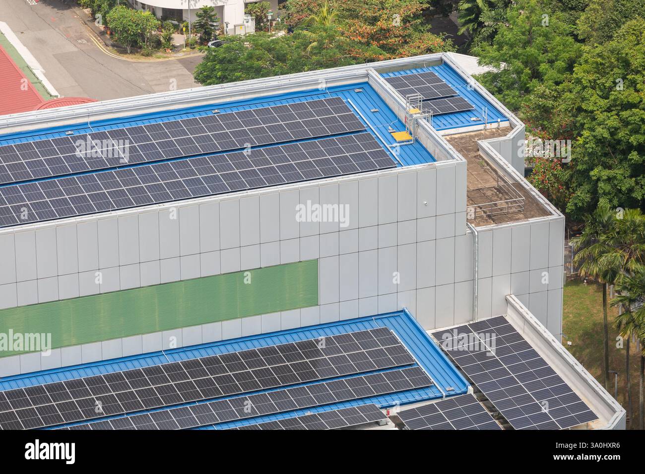 Aerial. Solar panels fitted on building roof top. Price of installation had gone down, benefit more companies, business. Energy supply. Singapore. Stock Photo