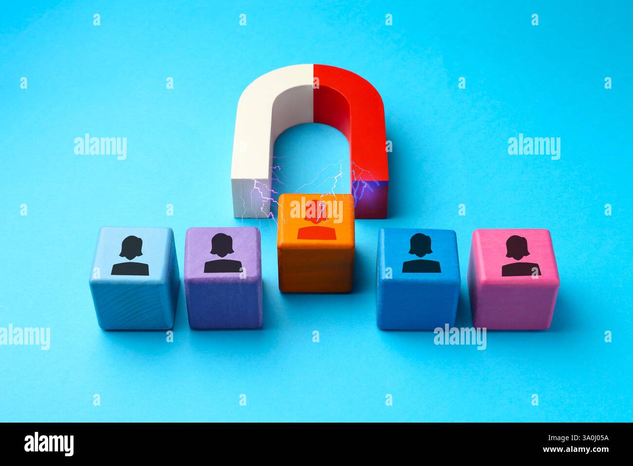 Magnet Recruitment Magnet attracting one of colorful cubes with human figures on light ...