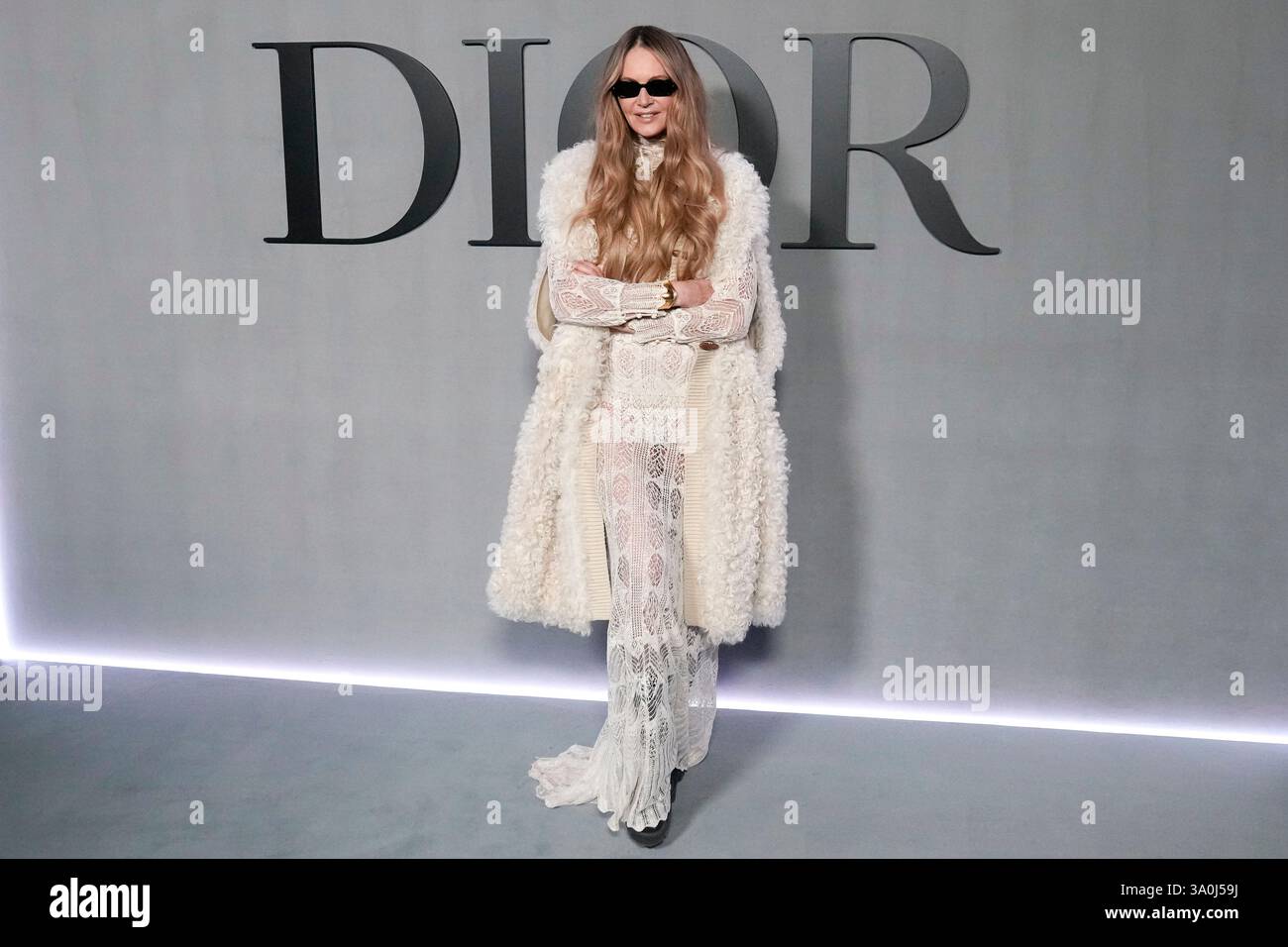 Elle Macpherson poses for photographers at the photo call for the Dior