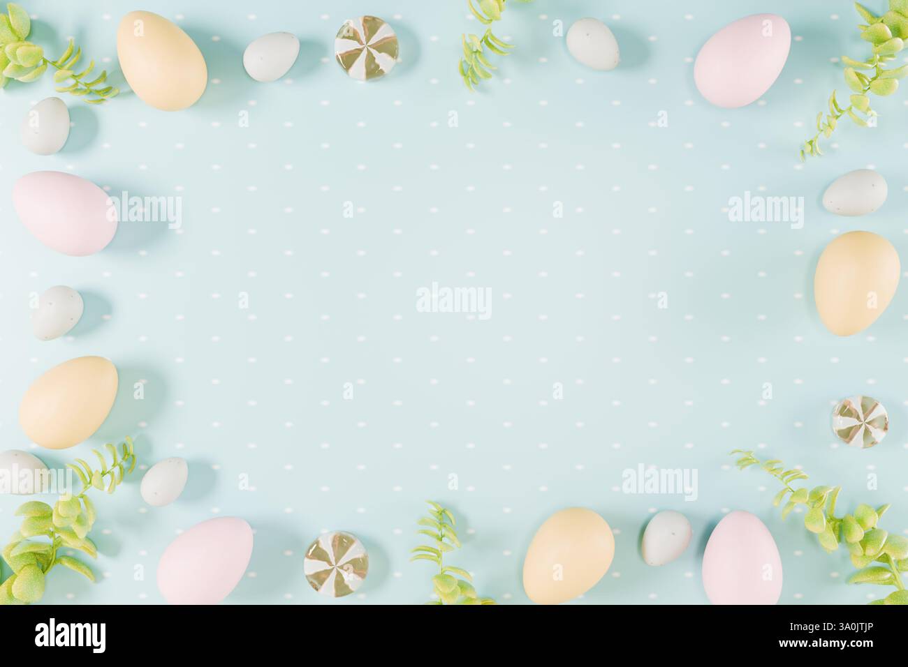 Easter themed arrangement of colorful eggs and greenery on a light blue ...