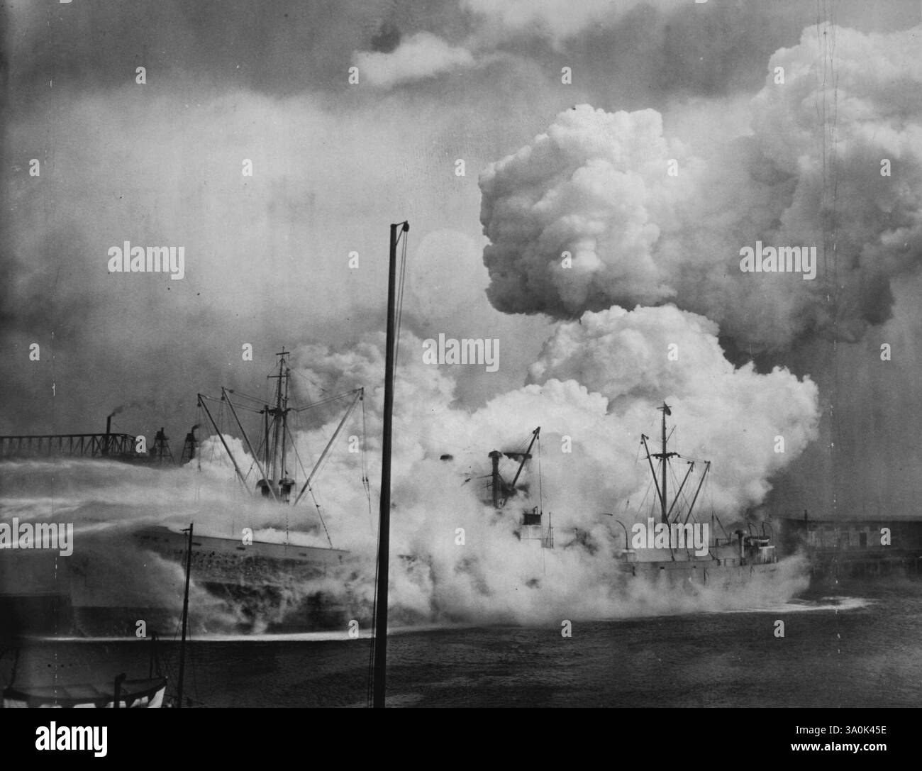 Explosion Rocks Blazing Freighter - The camera caught one of a series of blasts today as the nitrate and sugar loaded Freighter Laila caught fire in the harbor. March 10, 1937. (Photo by Associated Press Photo). Stock Photo