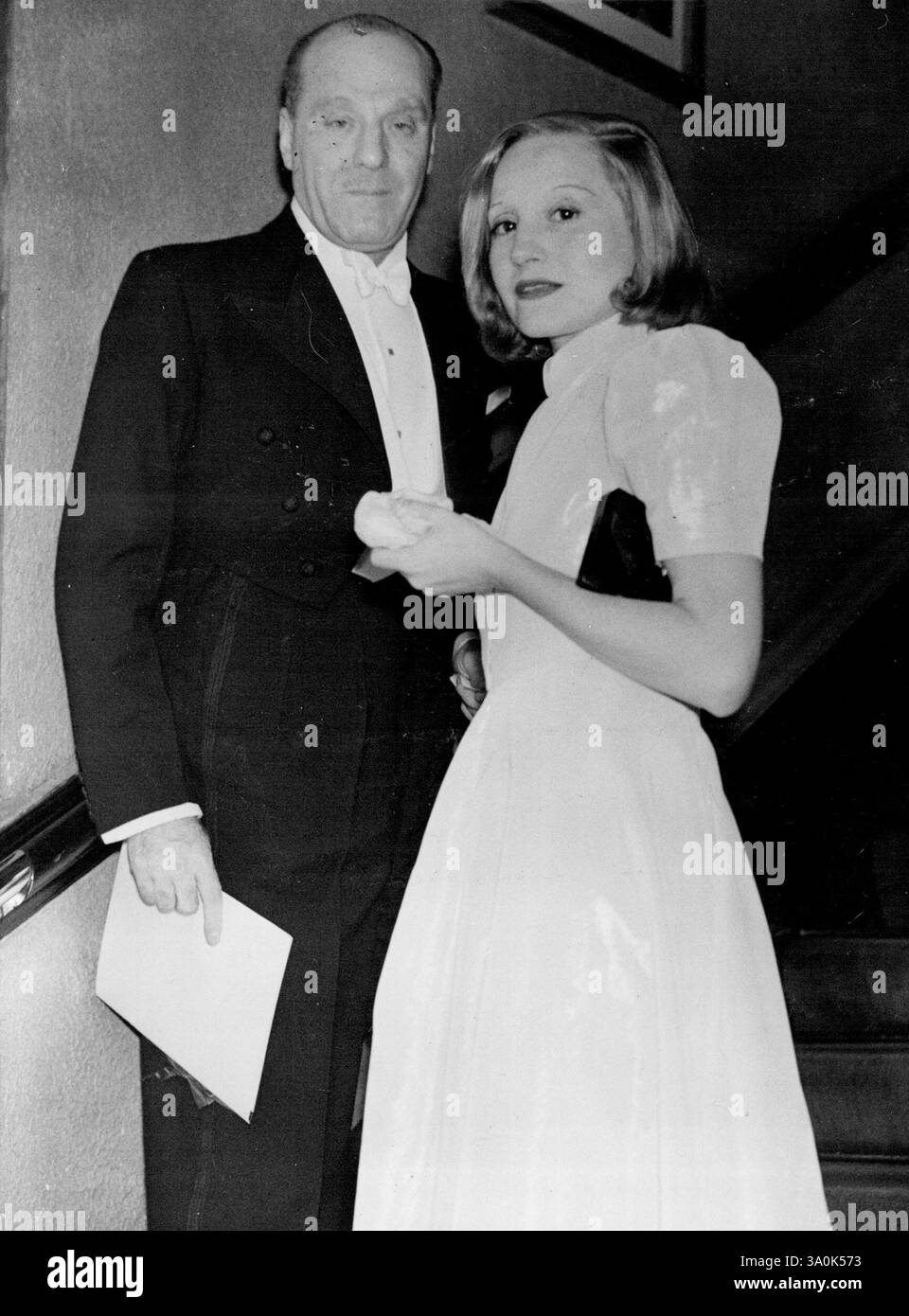 Elizabeth Bergner Presented To Queen Mary At Premiere Of Her New Film -- Elizabeth Bergner with her husband, Dr. Paul Czinner, who directed the film, at the premiere. Elizabeth Bergner was presented to Queen Mary at the premiere of her new film 'Dreaming Lips' given at the London Pavilion, Piccadilly Circus, London, in aid of the North London Group for Slum Clearance. February 02, 1937. Stock Photo