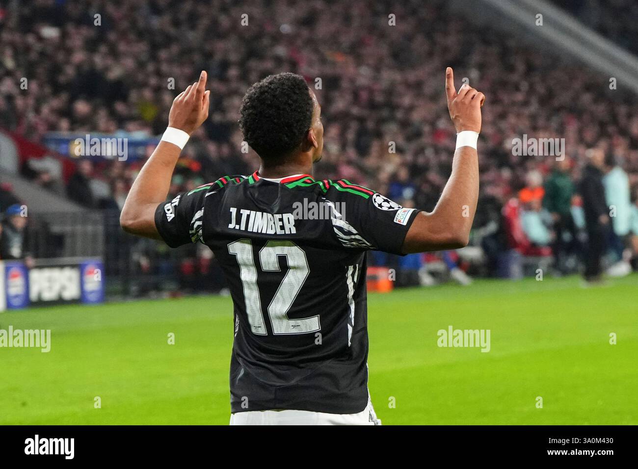 Arsenal's Jurrien Timber celebrates after scoring his side's first goal ...