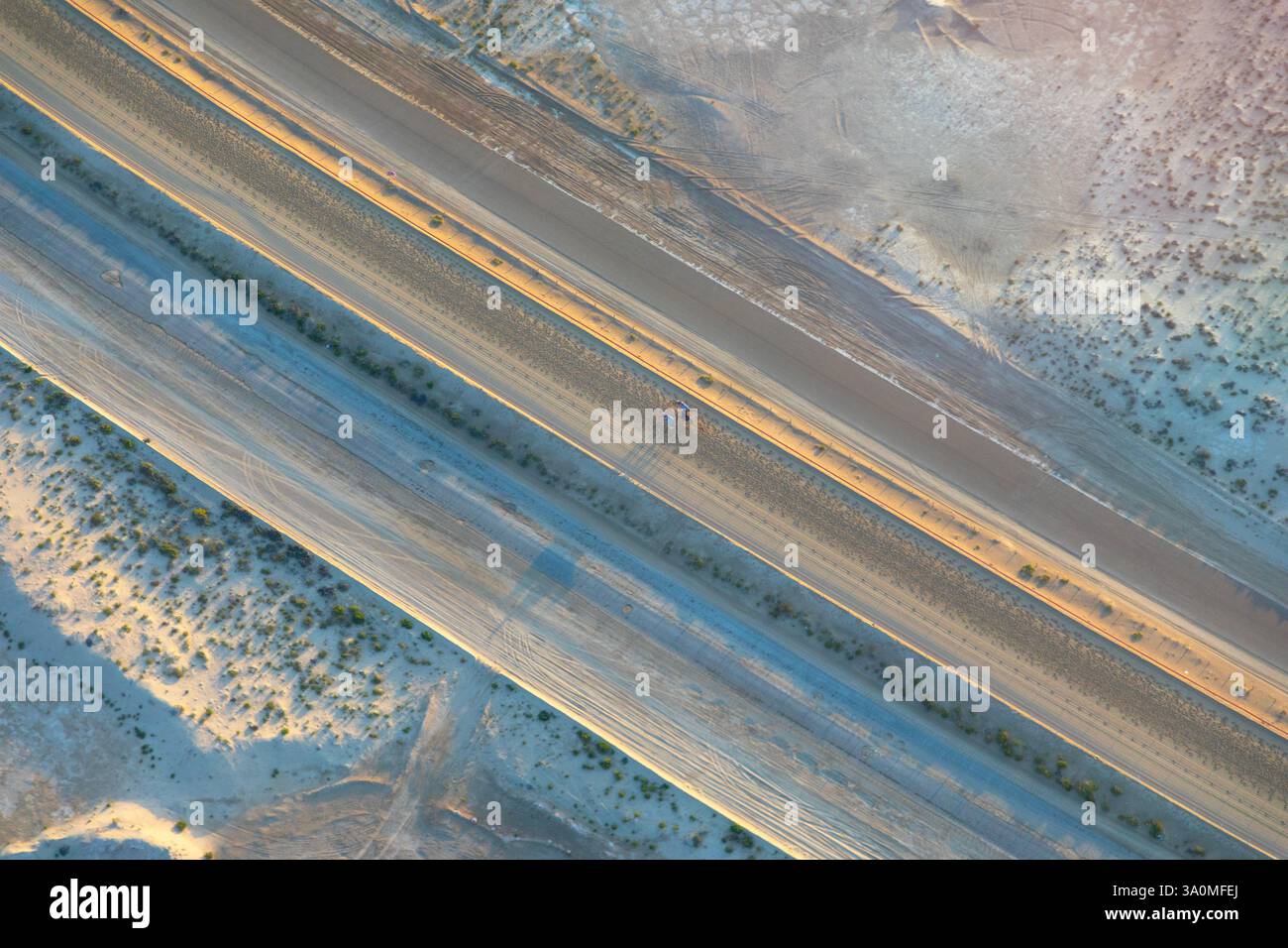 Aerial view of camel racing track winding through the desert in Abu Dhabi Stock Photo
