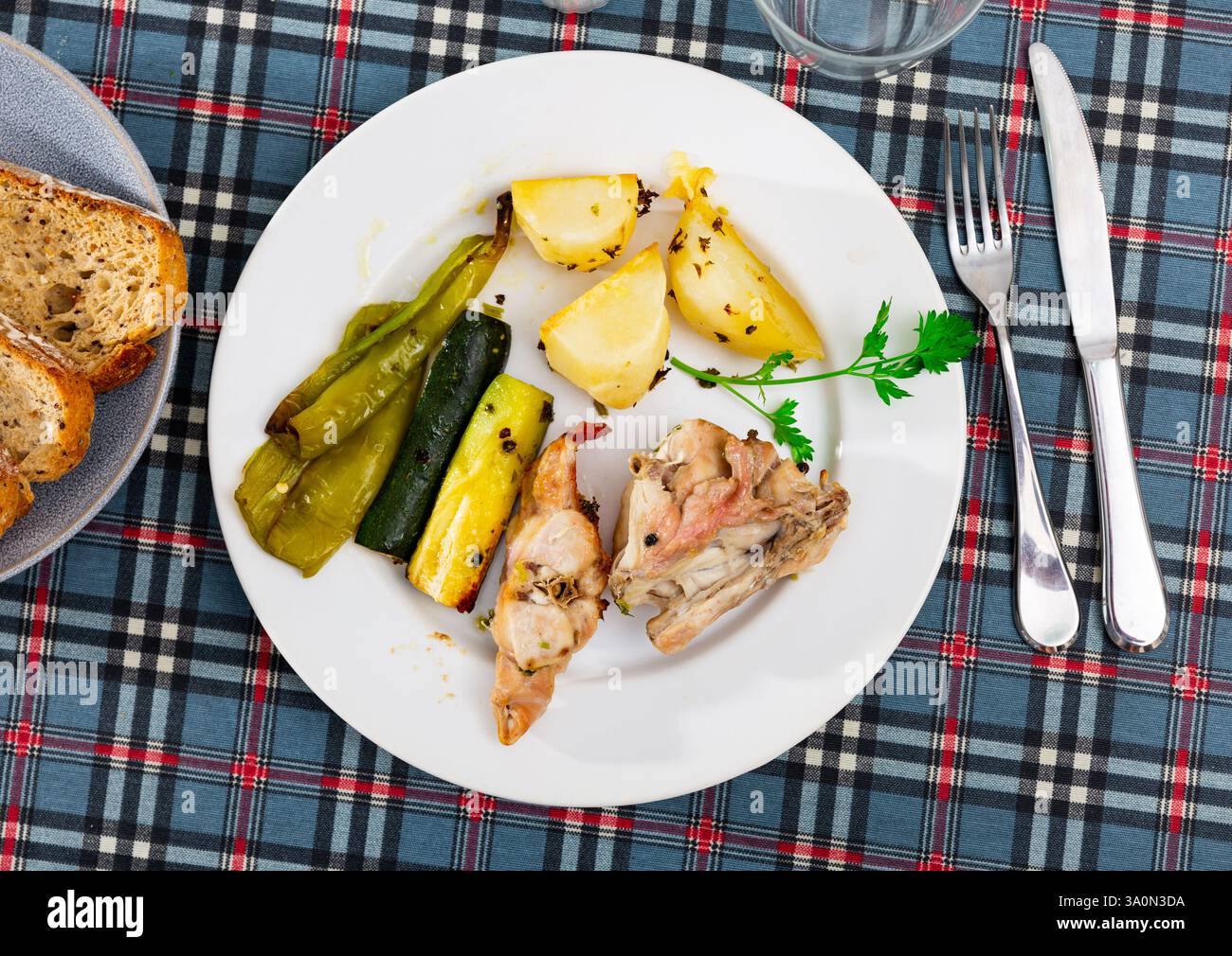 Roasted rabbit served with vegetable garnish Stock Photo