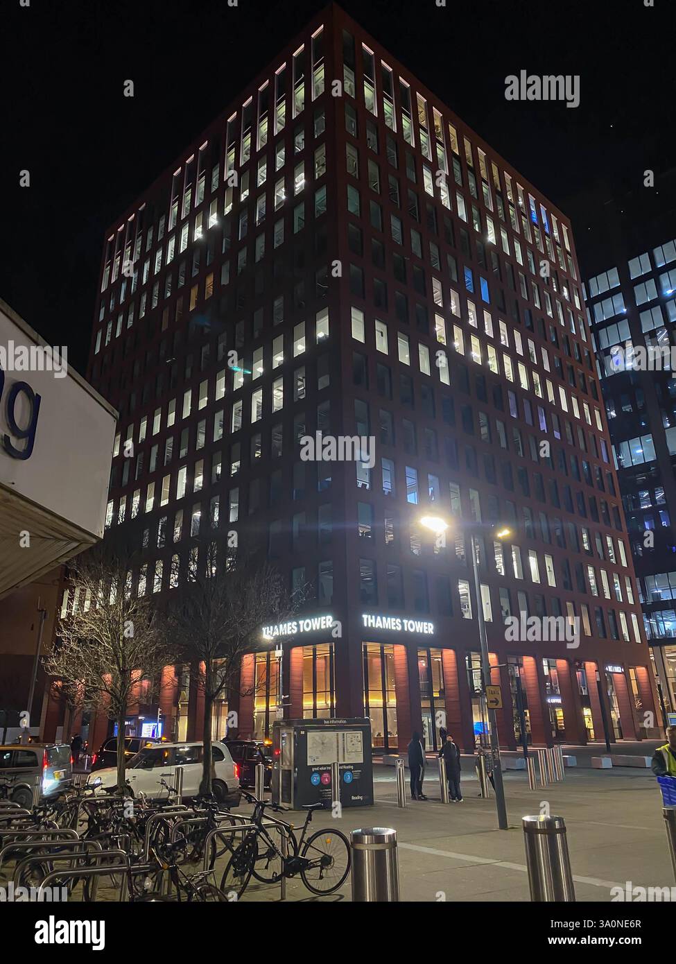 Thames Tower, a tower block on Station Hill in Reading, UK seen lit up at night. - Smartphone Captured Stock Image