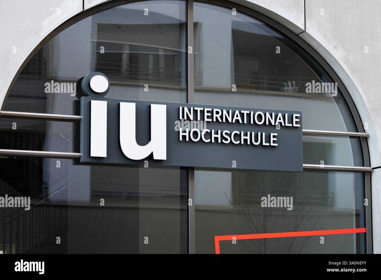 IU Internationale Hochschule logo sign on the building exterior. Dresden campus of the international university of applied sciences in Dresden city. Stock Photo