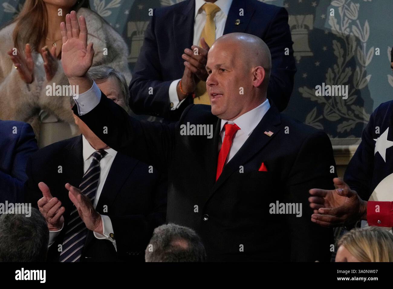Jeff Denard of Decatur, Ala., waves as President Donald Trump addresses ...