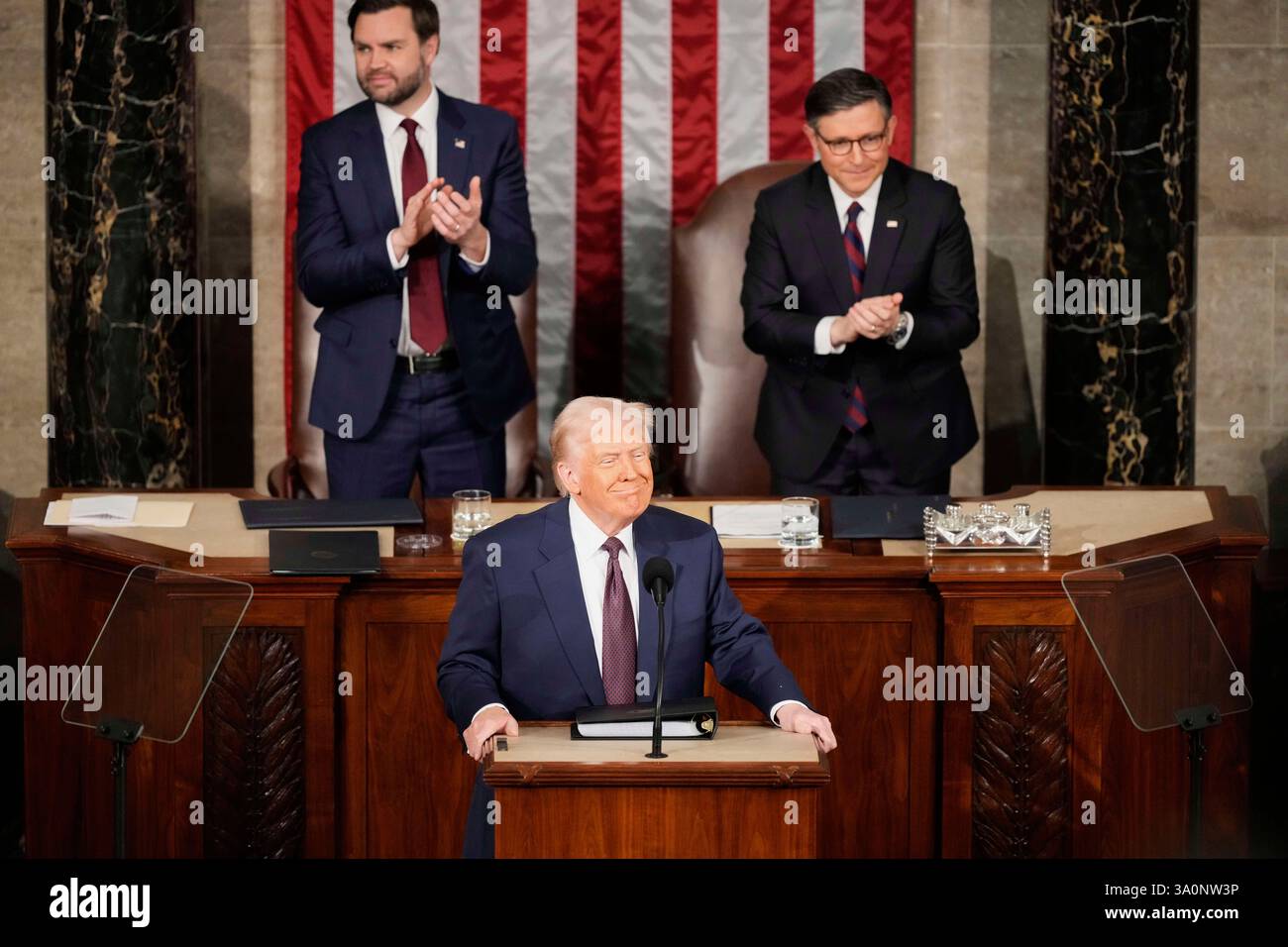 President Donald Trump pauses as Vice President JD Vance, left, and ...