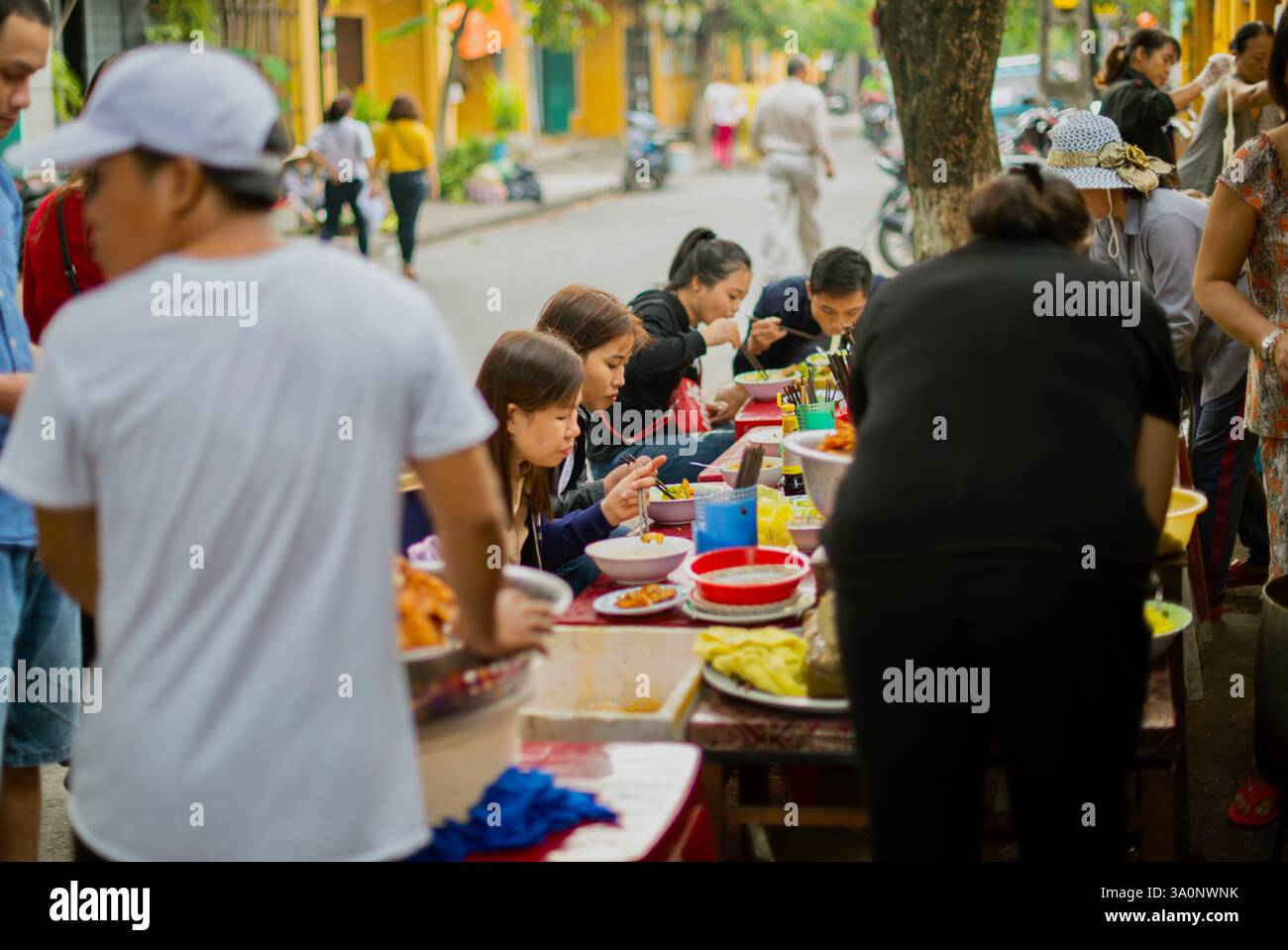Customers enjoy local fare at a cafe in HOI AN, Vietnam on 02 November 2017. Stock Photo