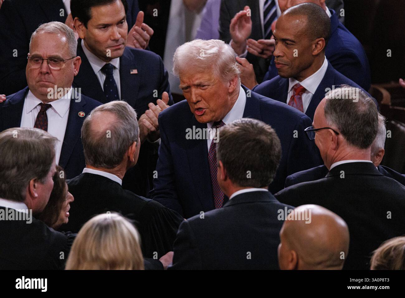 Washington, Vereinigte Staaten. 04th Mar, 2025. US President Donald J. Trump speaks with Justices of the US Supreme Court as he arrives to deliver his first State of the Union address of his second term to a joint session of the US Congress in the Hall of the US House of Representatives in the US Capitol in Washington, DC on Tuesday, March 4, 2025. Credit: dpa/Alamy Live News Stock Photo