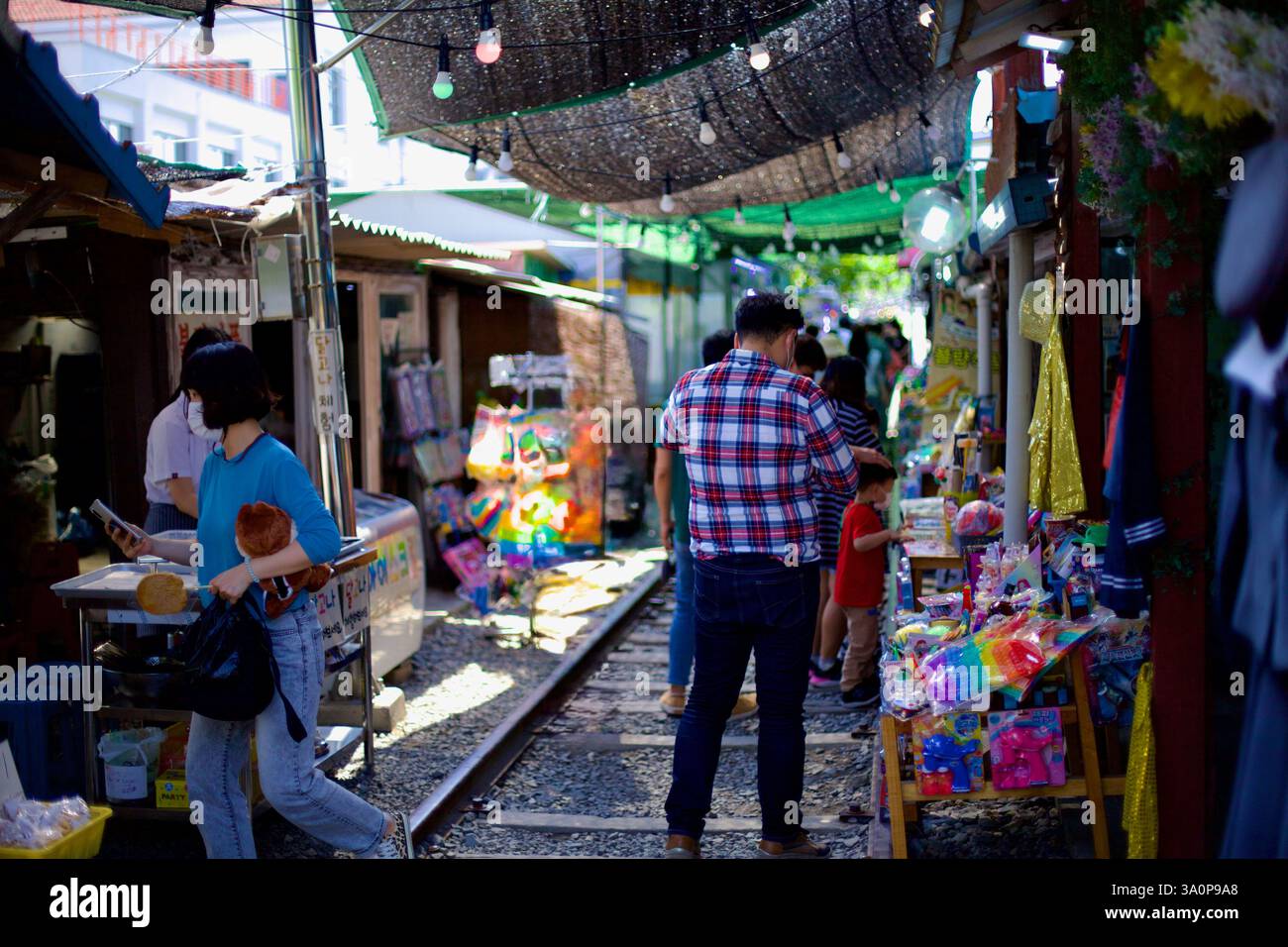 Gunsan, South Korea - May 28, 2021: Shoppers browse colorful stalls ...