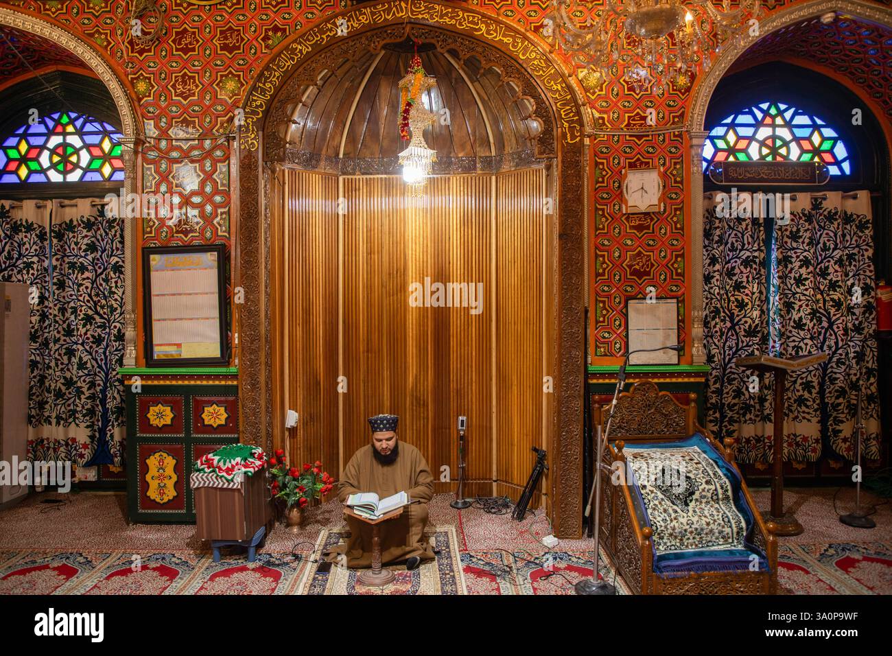 A Kashmiri Muslim man recites the Islamic Holy Book Quran inside the ...
