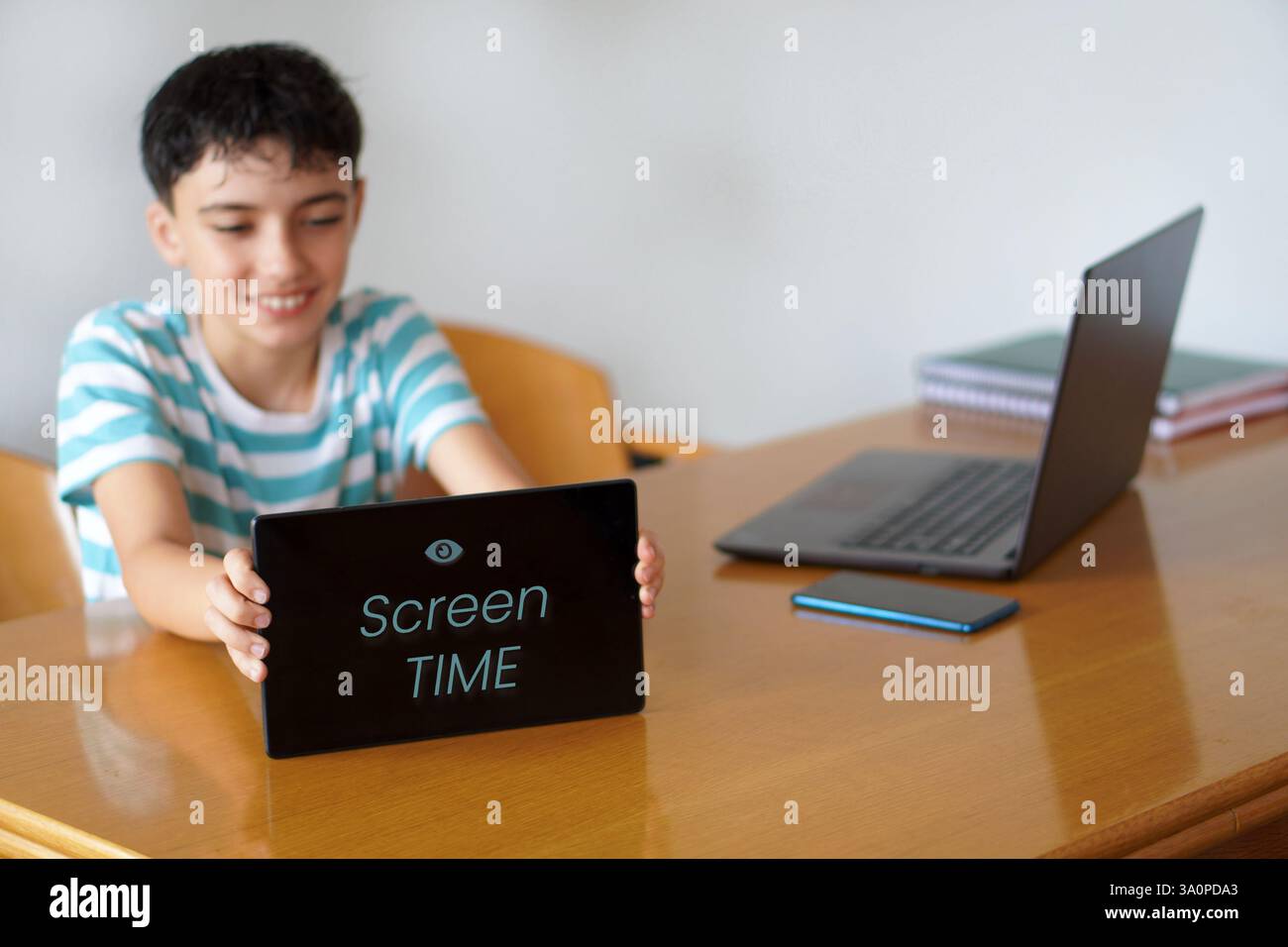screen time concept. preteen child unfocused happy with screen time ...