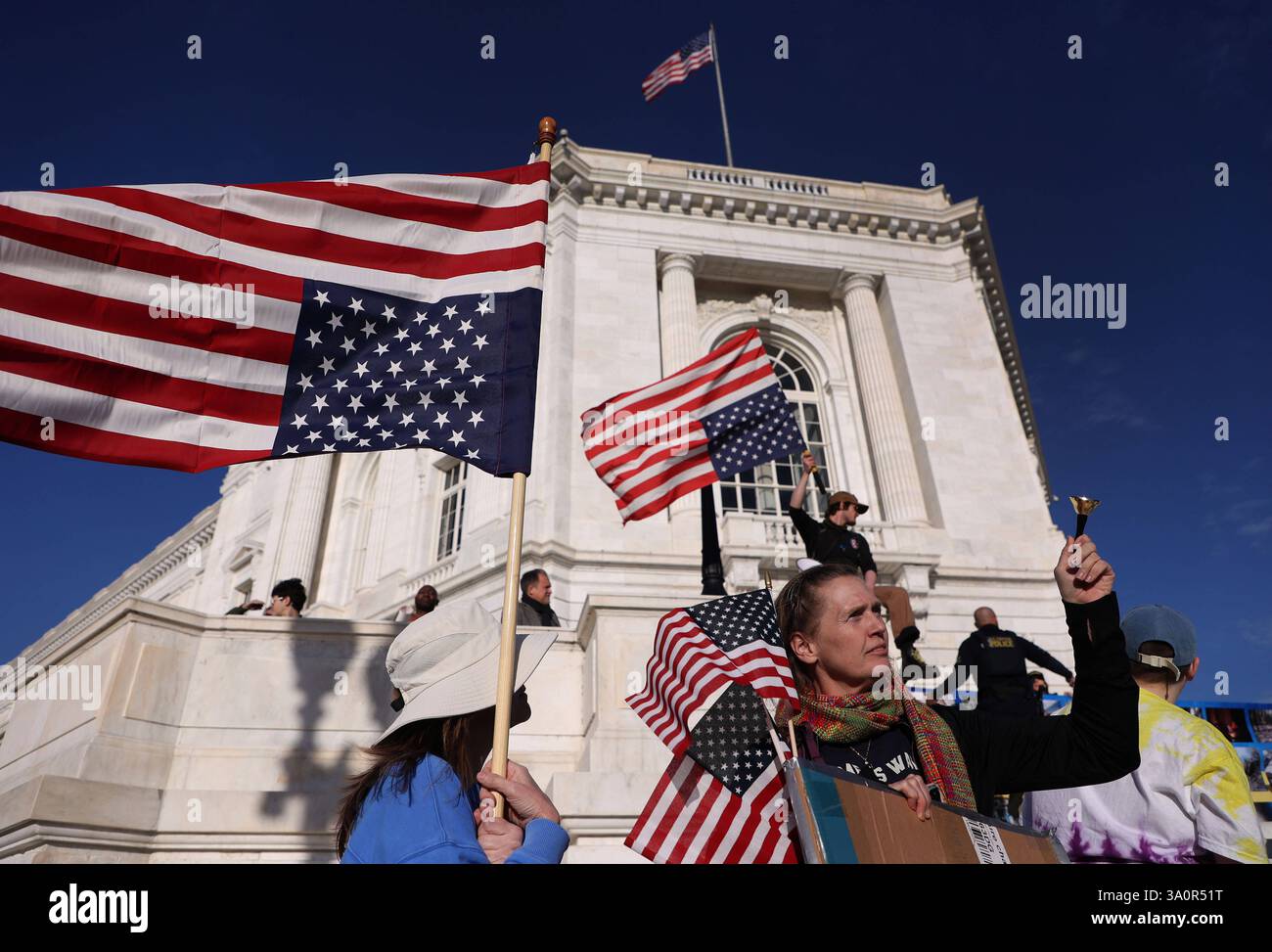 Demonstrators protest ahead of President Donald Trump address to a ...