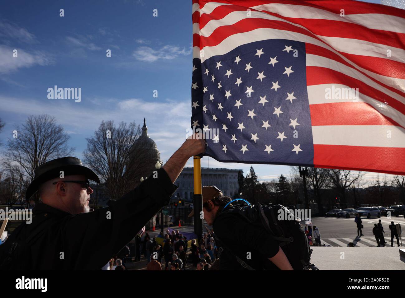 Demonstrators protest ahead of President Donald Trump address to a ...