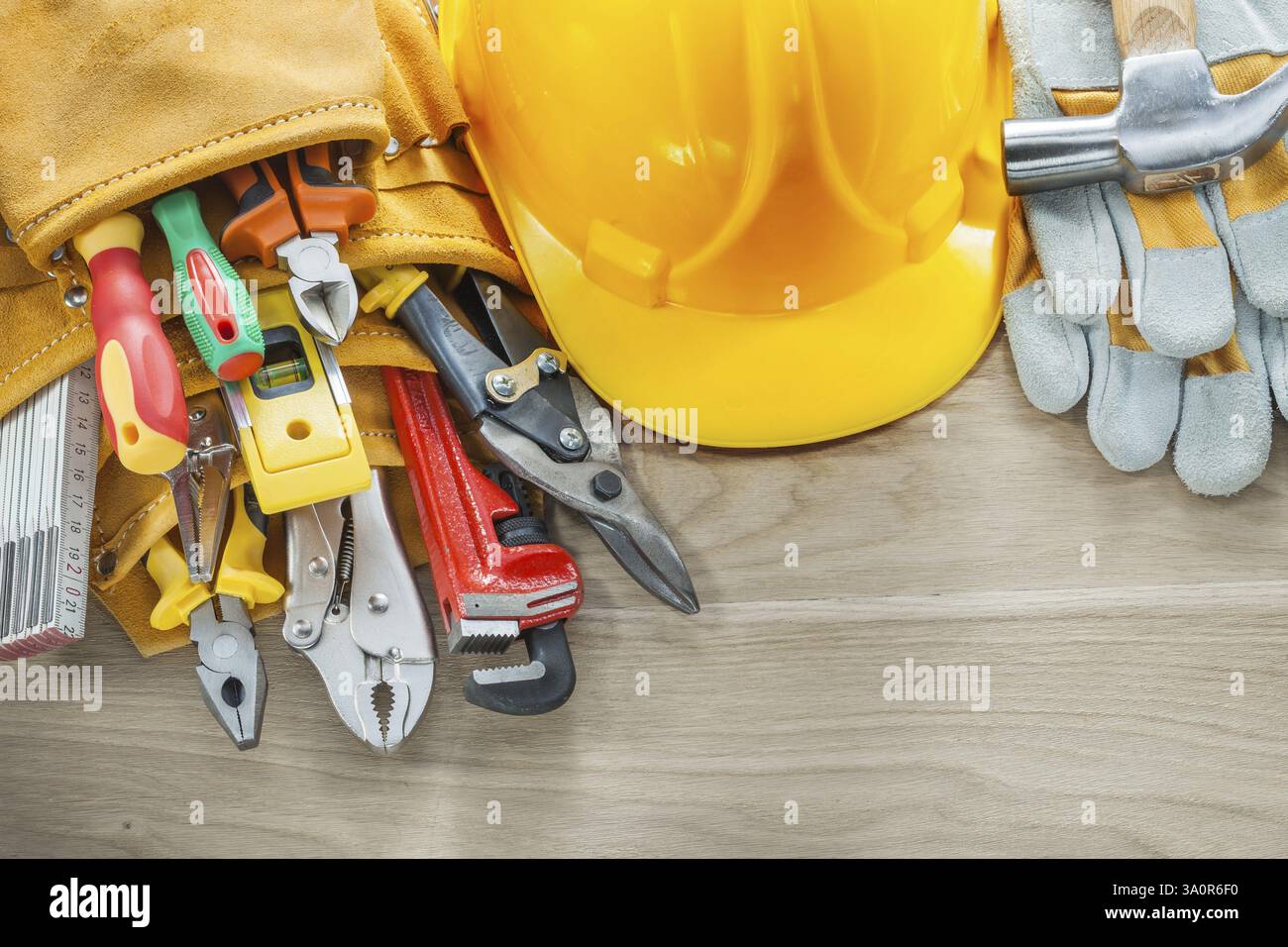 Construction tooling tool belt protective gloves building helmet Stock Photo