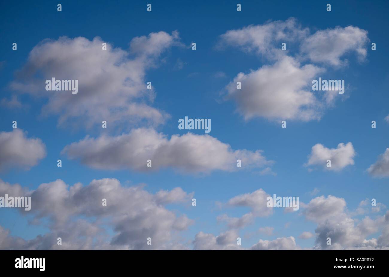Blue 'Simpsons Sky' - clear blue sky with white fluffy clouds Stock Photo