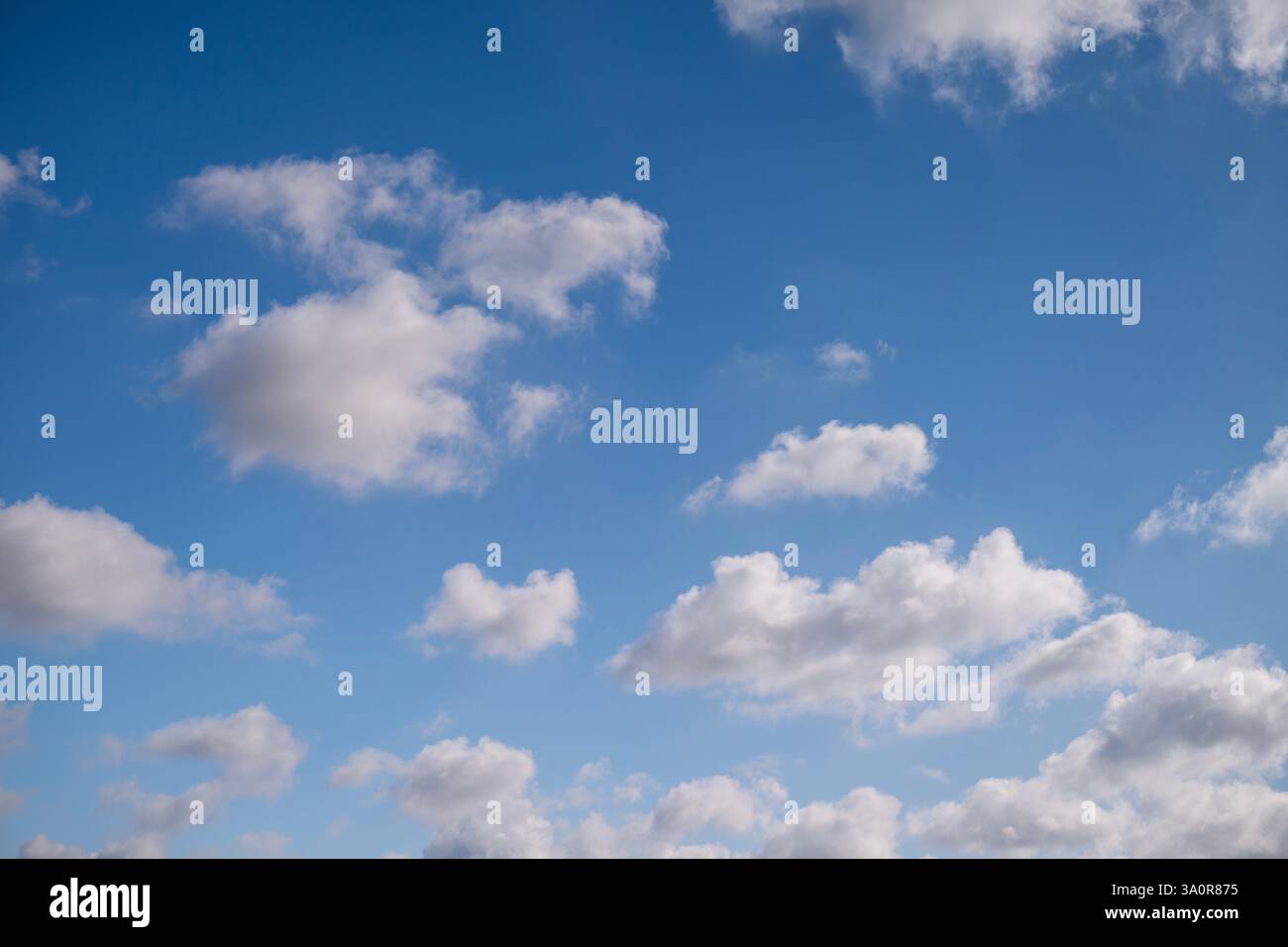 Blue 'Simpsons Sky' - clear blue sky with white fluffy clouds Stock Photo