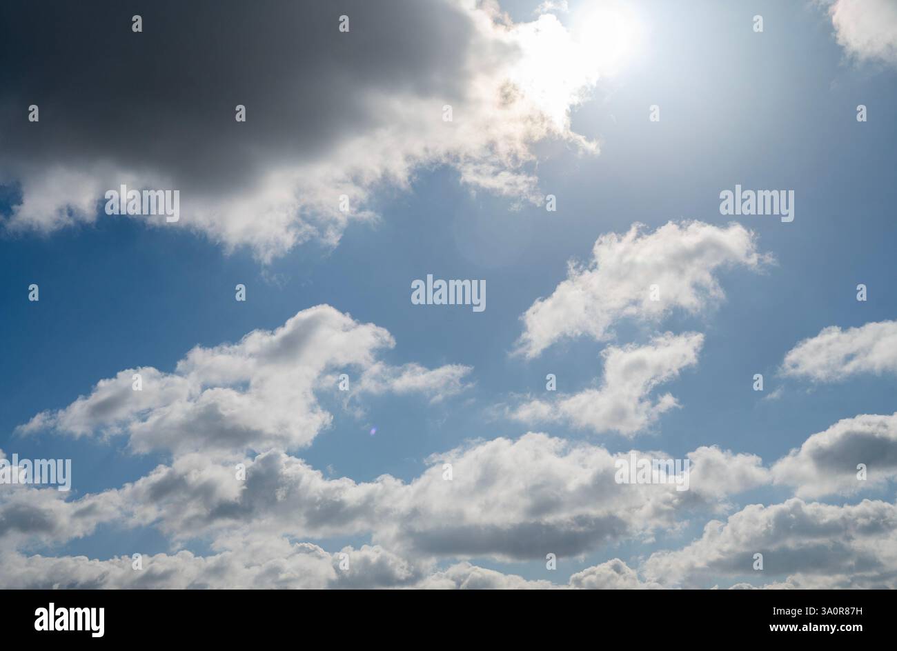 Blue 'Simpsons Sky' - clear blue sky with white fluffy clouds Stock Photo