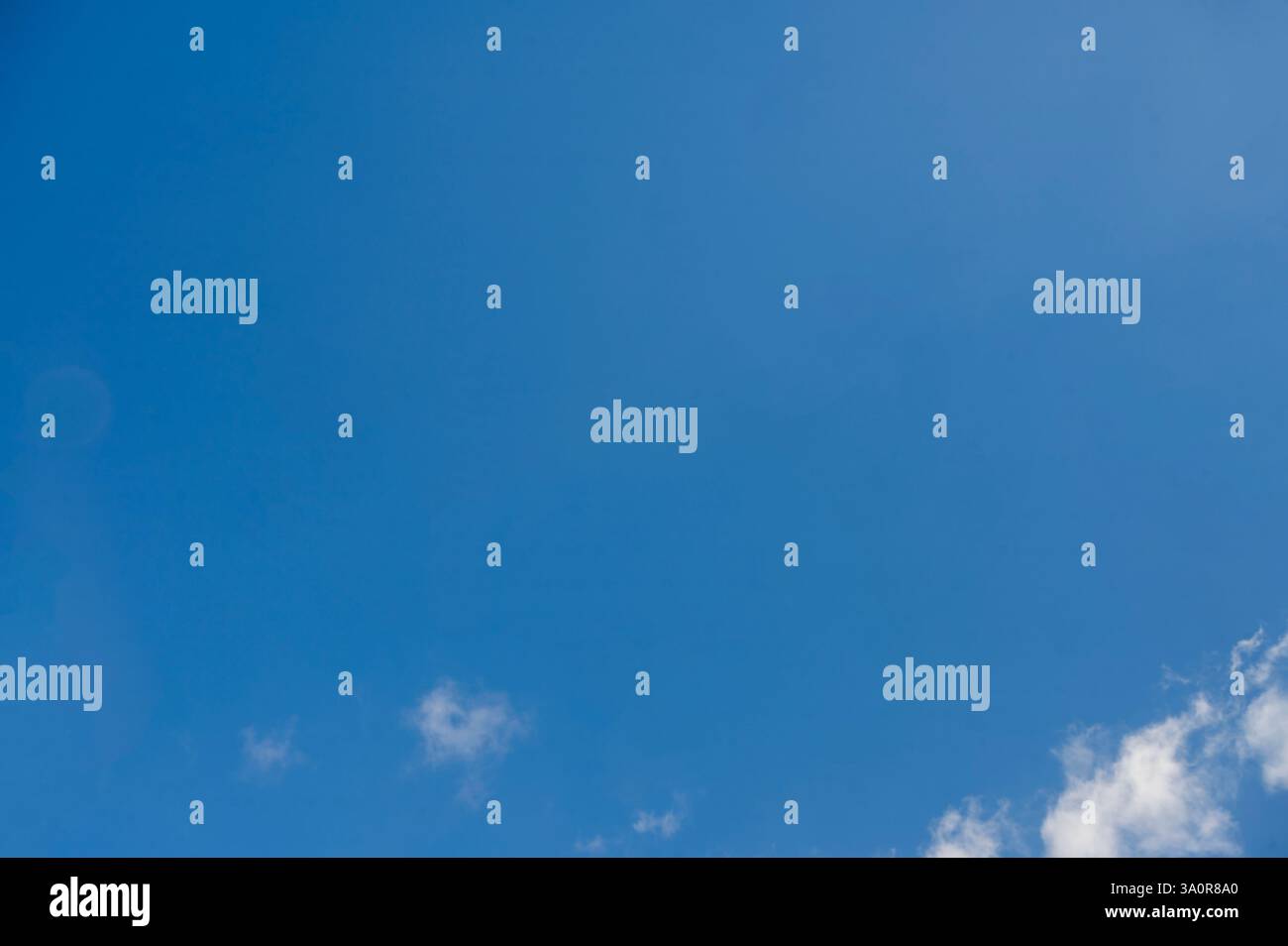 Blue 'Simpsons Sky' - clear blue sky with white fluffy clouds Stock Photo