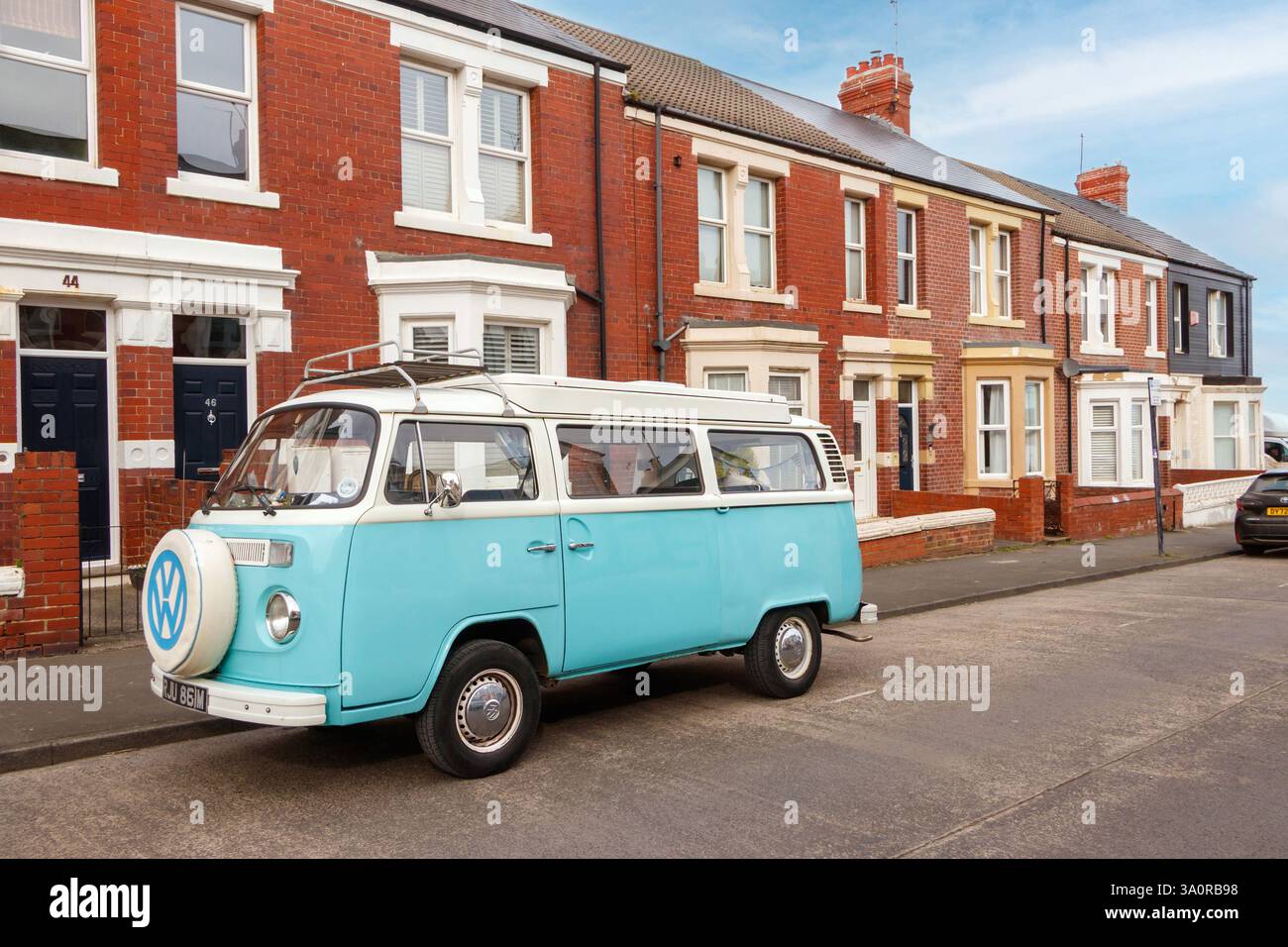 two tone light blue vintage classic volkswagen T2 VW camper bus parked ...