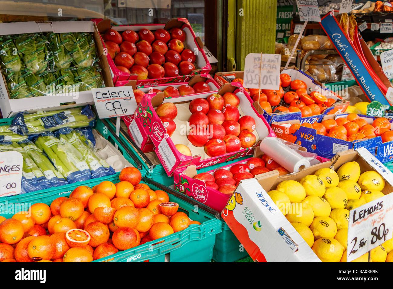 close up of boxes of avocados  oranges potatoes fruit and vegetables on a stall in a fruit shop grocer in Whitley Bay, tyne & wear, Stock Photo