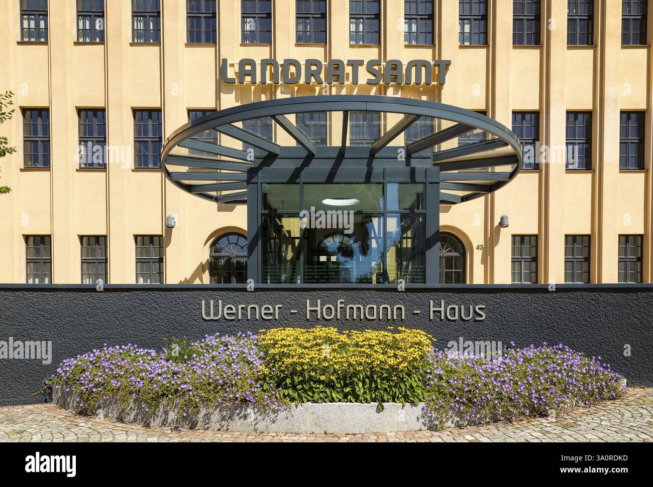 Former porcelain factory, today district administration office, entrance area with lettering Werner-Hofmann-Haus, Freiberg, Saxony, Germany, Europe Stock Photo