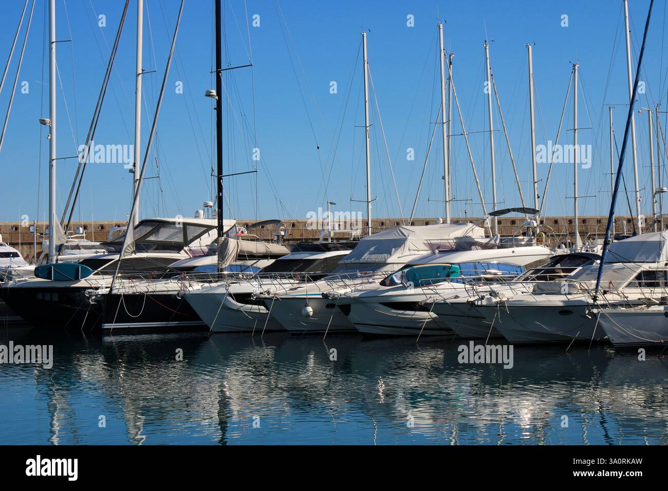Luxury yachts docked in French riviera marina under a clear sky Stock ...