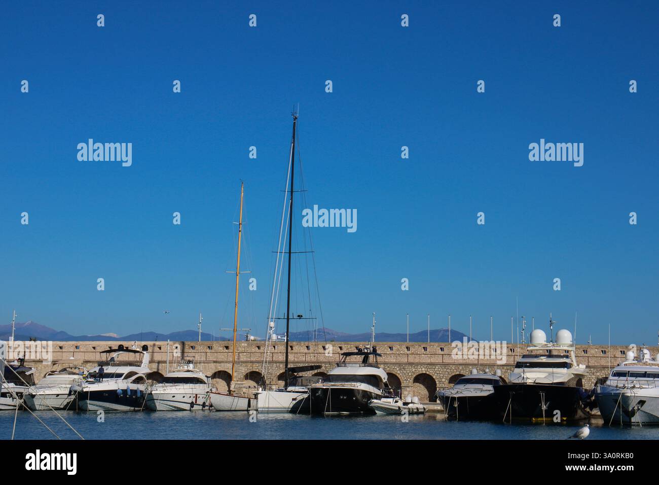 Luxury yachts docked in French riviera marina under a clear sky Stock ...