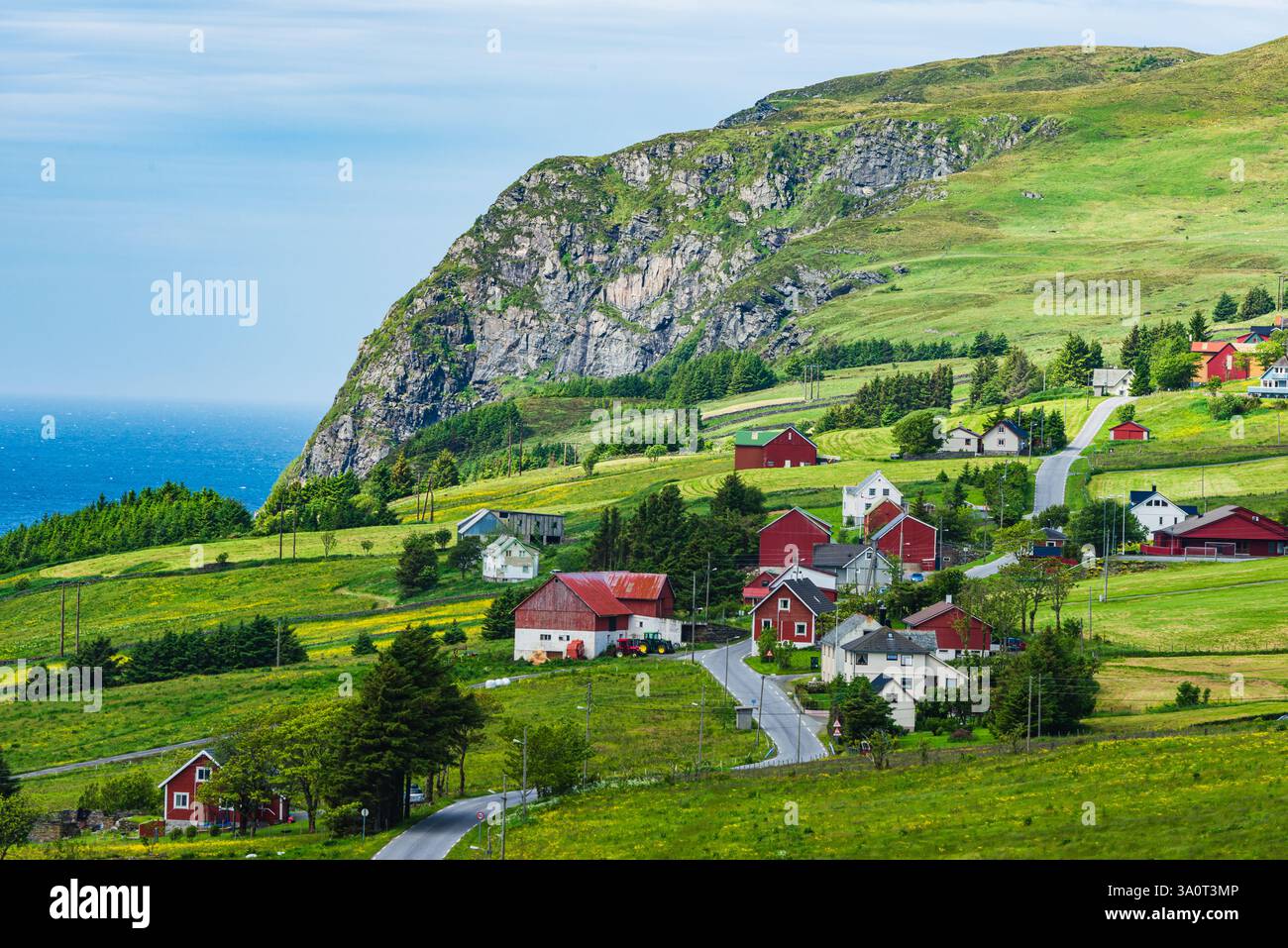 This rural setting showcases charming red houses nestled among lush ...